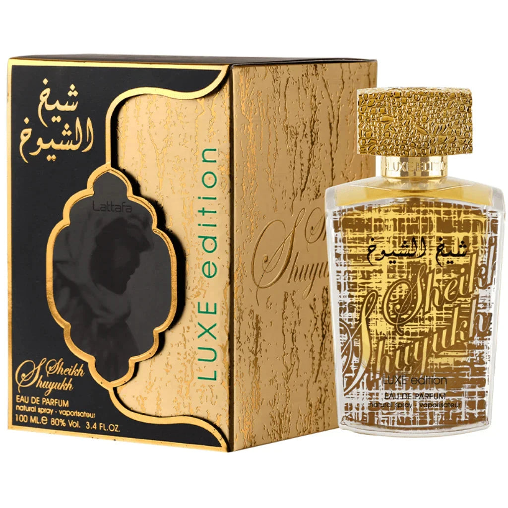 A boxed and unboxed view of Sheikh Al Shuyukh Luxe Edition by Lattafa Perfumes. The packaging features a gold and black design, with intricate detailing and Arabic calligraphy. The words "Luxe Edition" are displayed on the side of the box, and the front h