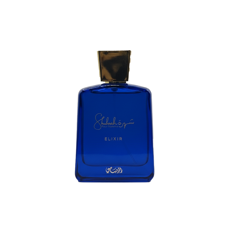 Shuhrah Pour Homme Elixir perfume bottle in deep blue glass with gold cap and elegant script label.