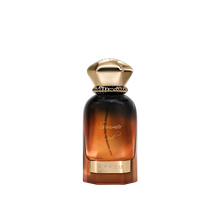 Summer Oud perfume by Ahmed in an amber gradient glass bottle with a gold cap and gold nameplate detail.
