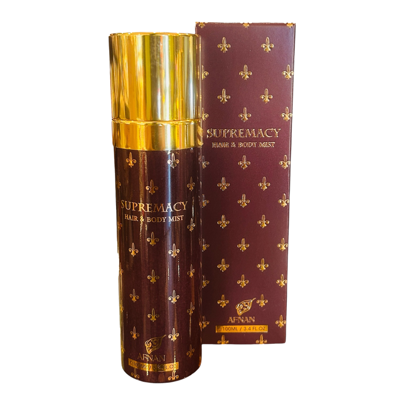 Afnan Supremacy Hair & Body Mist in a burgundy bottle with gold fleur-de-lis pattern and matching box beside it.
