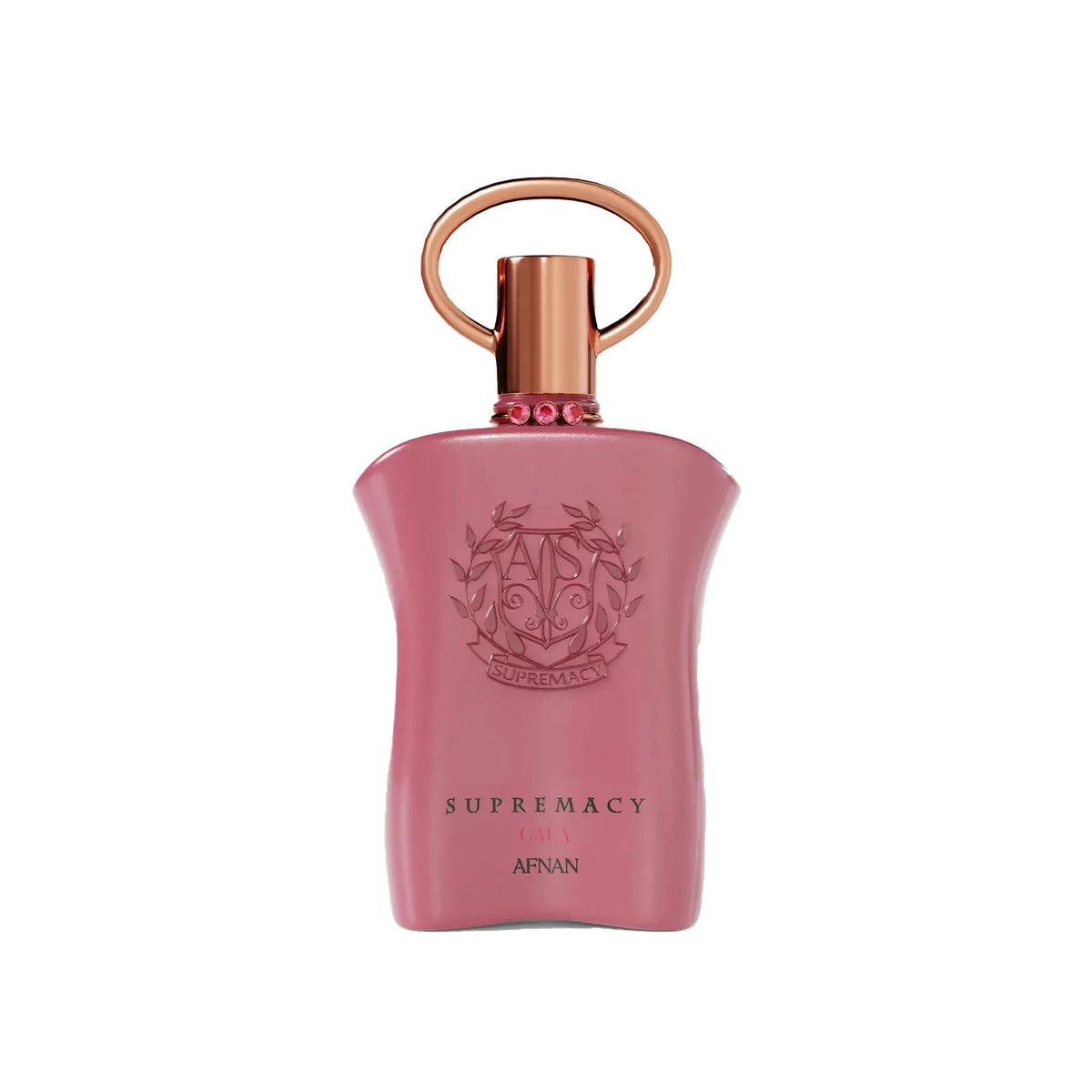 The image shows a pink perfume bottle with a metallic gold cap and a ring-shaped detail on top. The front of the bottle displays embossed text and a decorative emblem featuring the initials 'AP' in a stylized design, surrounded by a wreath-like motif. Below the emblem, the words "SUPREMACY GALA AFNAN" are printed in a simple, elegant font. The bottle has a smooth, matte finish, and there are small, pink gemstone-like embellishments around the neck.