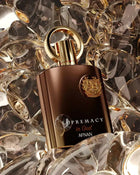 The image features a luxurious perfume bottle with a matte brown body and a polished golden cap, adorned with a round golden ring on top. The bottle is set against a mesmerizing background of reflective crystal-like shapes with gold accents, creating an opulent and dynamic backdrop. A detailed golden emblem is embossed on the front of the bottle, and below it, the perfume's name "SUPREMACY in Oud AFNAN" is written in elegant gold lettering.