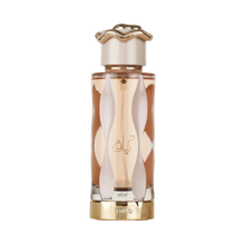 The bottle has a sleek, elongated shape with a clear glass revealing the amber-colored perfume inside.