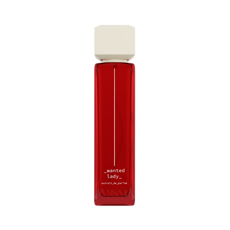 Assaf Wanted Lady Extrait De Parfum in a sleek translucent red glass bottle with an ivory square cap.