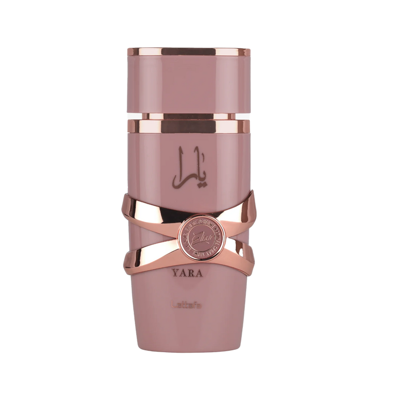 Lattafa Yara Elixir perfume bottle in dusty pink with rose gold accents and Arabic script, featuring a round emblem detail.