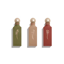 Three perfume bottles with gold caps and 'Ibrac' branding on a white background